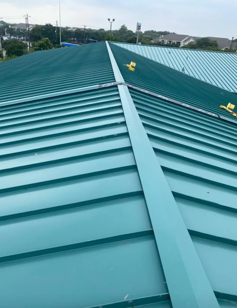 Green commercial metal roof ridge and valley for Metal Roof Repair in Lake Magdalene